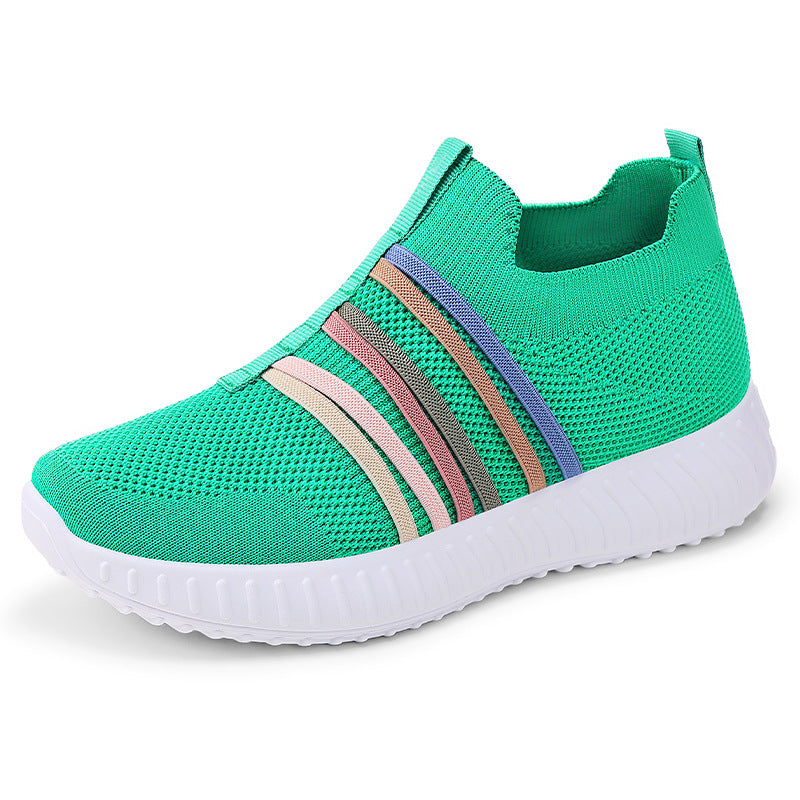 Green slip-on sneaker with colorful stripes on a white background