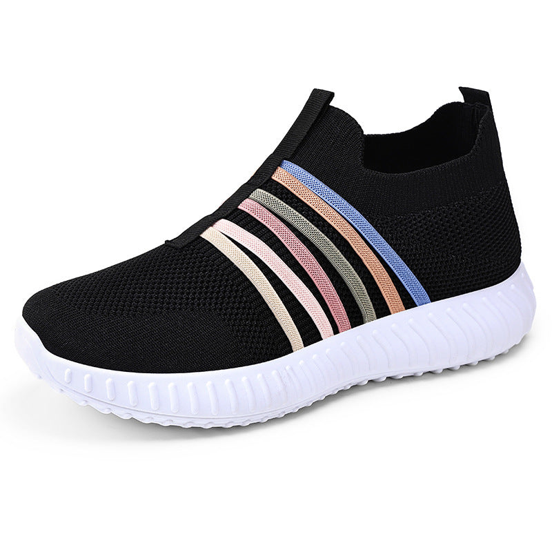 Black slip-on sneaker with colorful stripes on a white background