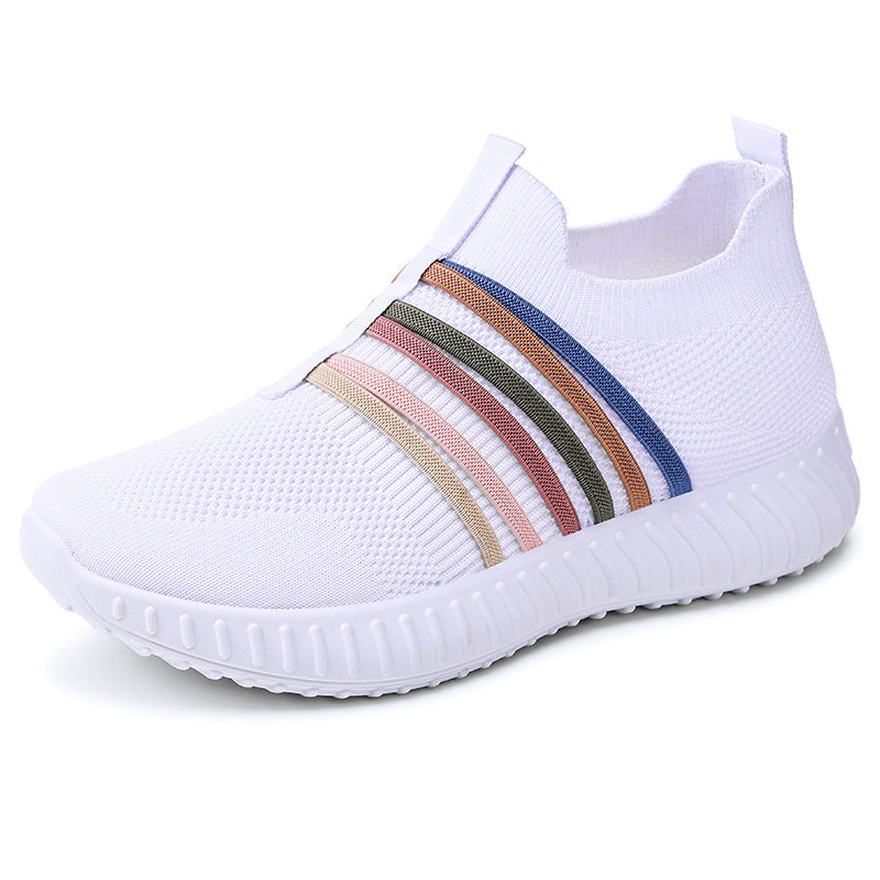 White slip-on sneaker with colorful stripes on a white background